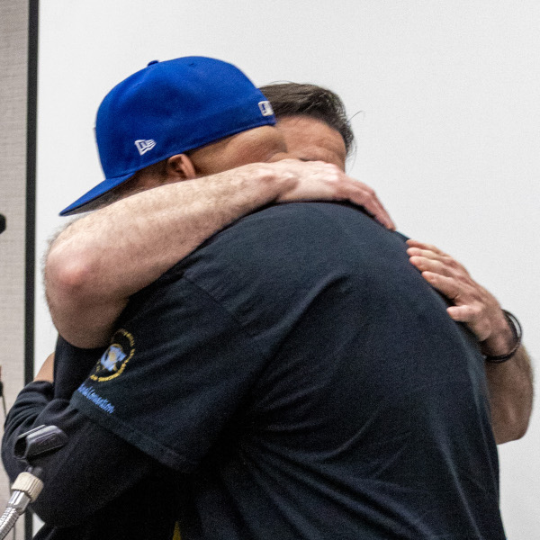 Two men embracing