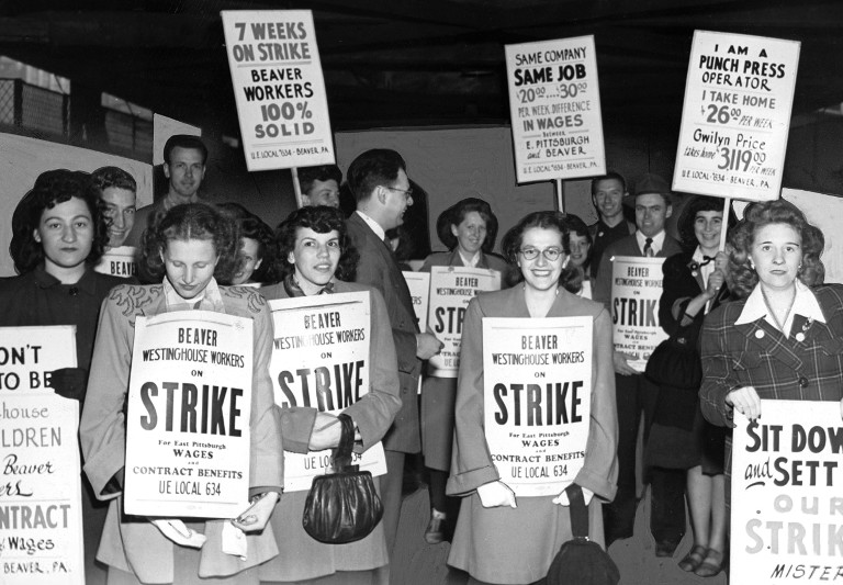 A group of striking Westinghouse workers, mostly young women, with picket signs