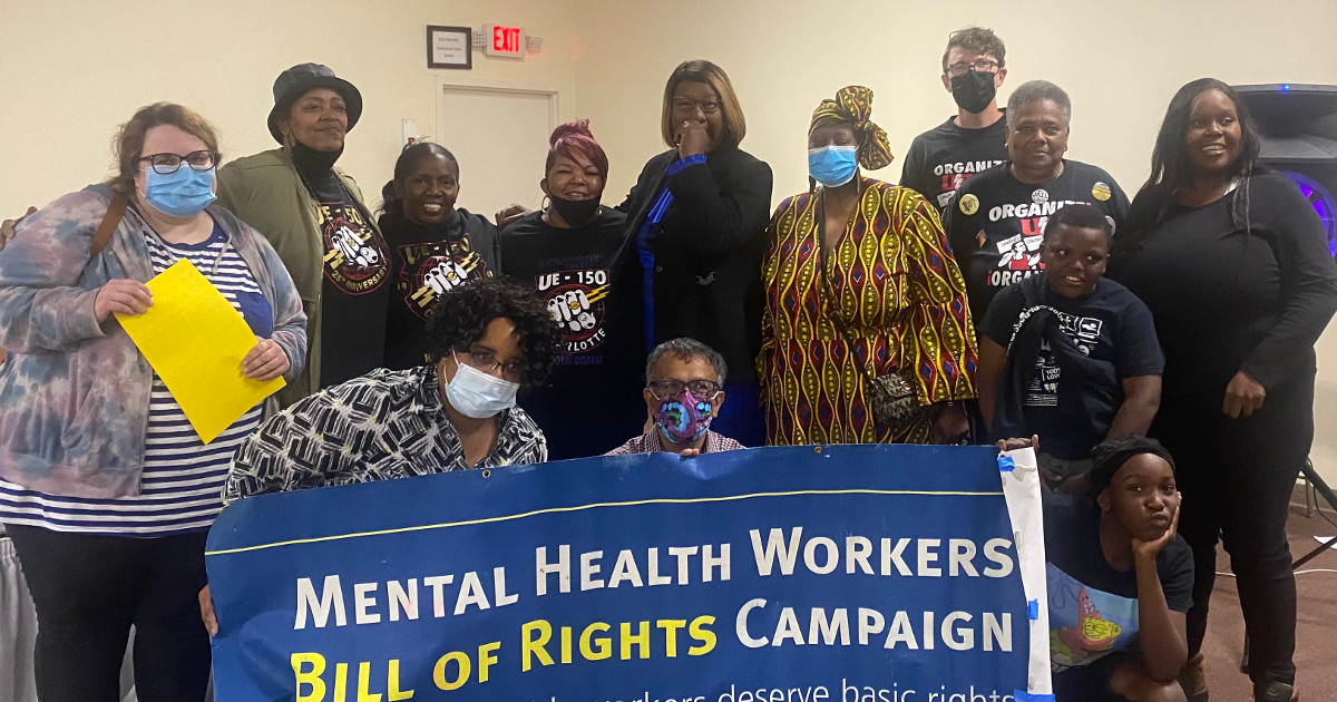 Local 150 members with Mental Health Workers Bill of Rights Campaign banner