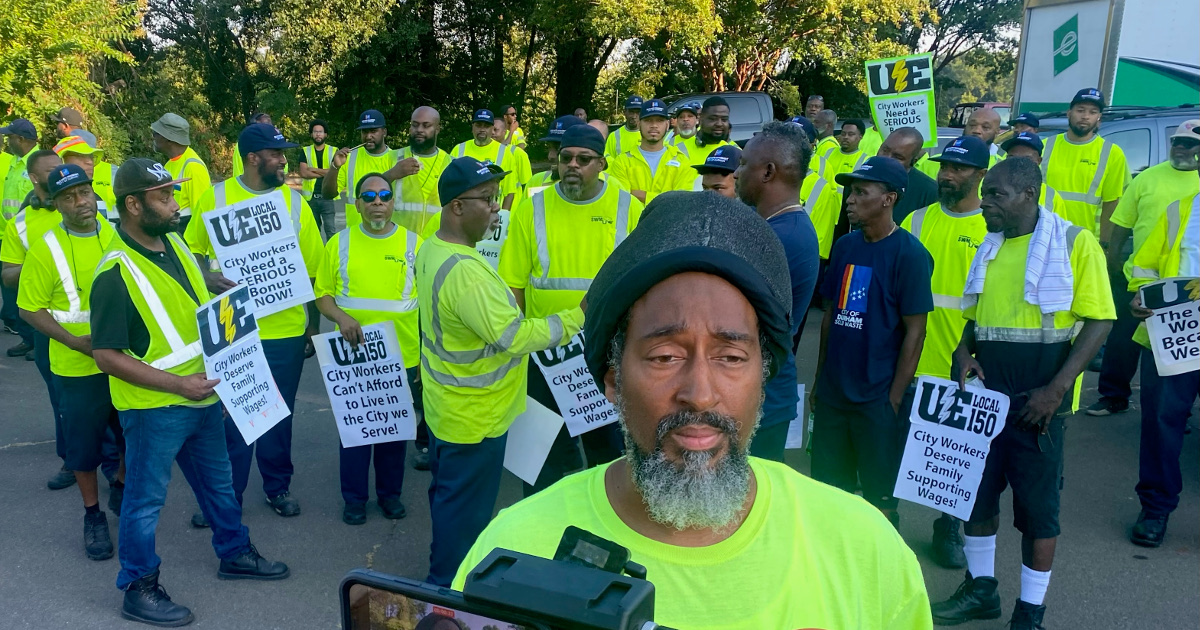 Durham, NC sanitation workers with UE signs