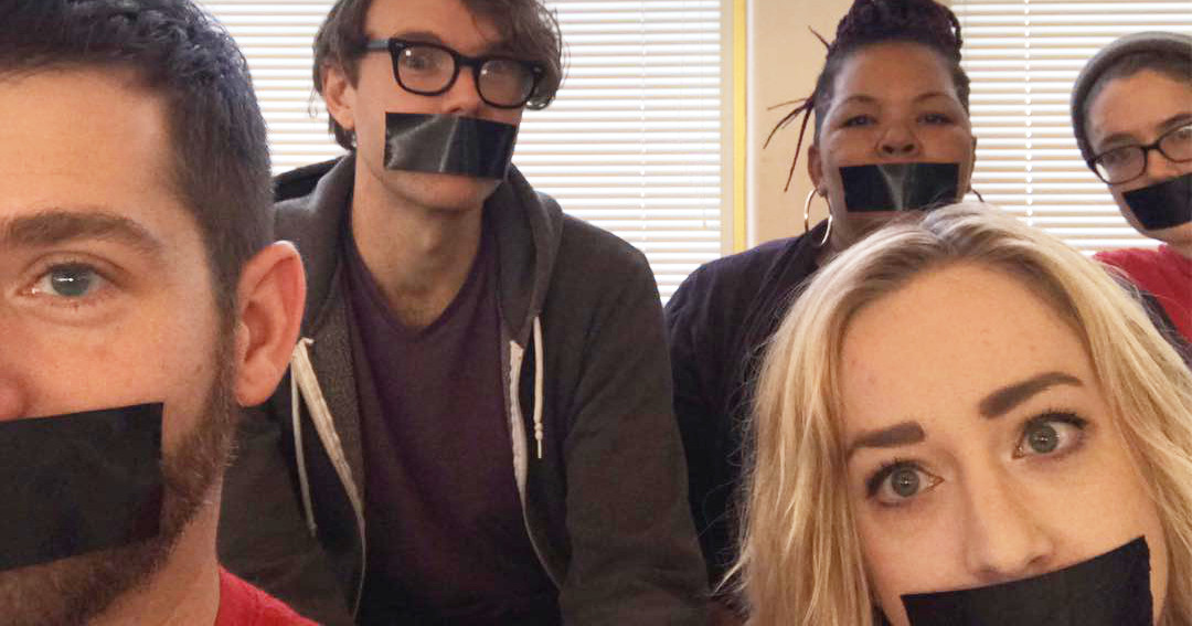UE members with duct tape over their mouths