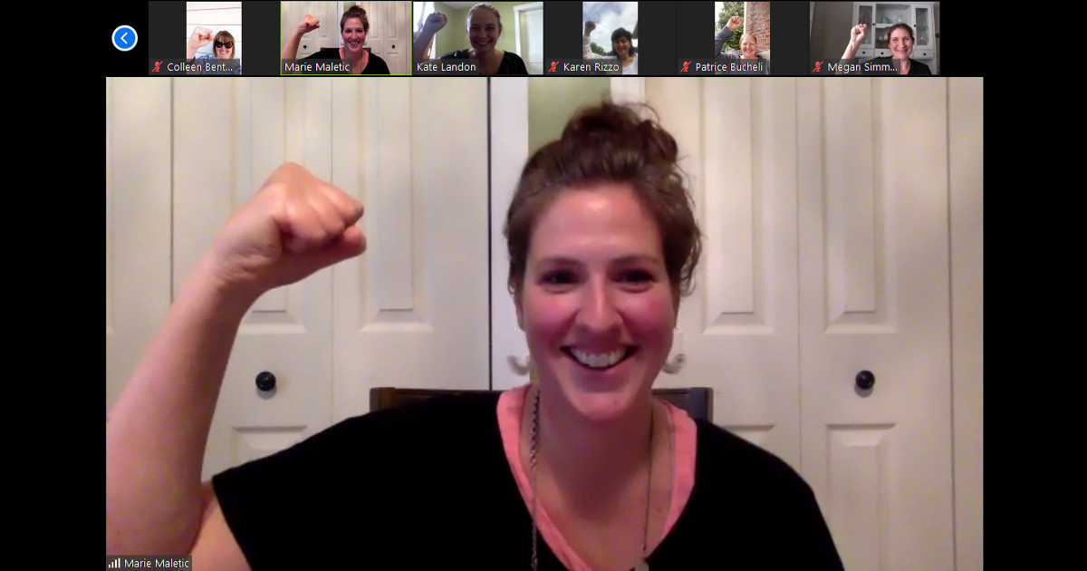 Six UE members raise their fists on a Zoom meeting