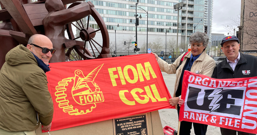 FIOM-CGIL and UE flags at Haymarket monument
