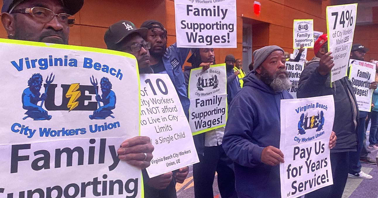 Workers with signs reading Family Supporting Wages! and Pay Us for Years of Service!