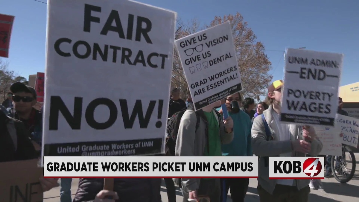 UE Local 1466-UGW members picketing with signs reading Fair Contract Now