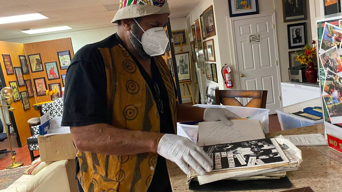 Angaza Laughinghouse, 71, a labor organizer and founding member of Black Workers for Justice, flips through his organization’s archives in Raleigh. Photo: Brian Gordon