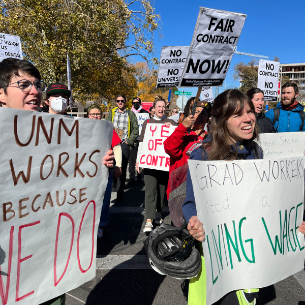 UE Local 1466-UGW members with signs reading UNM Works Because We Do and Fair Contract Now!