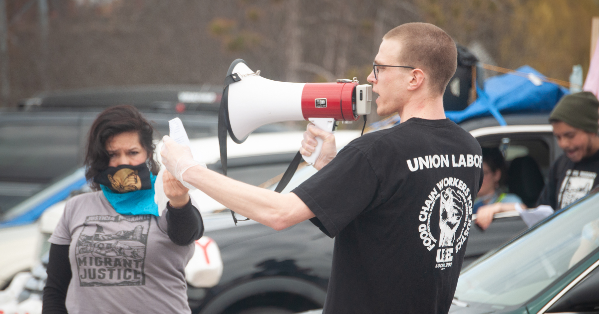 Local 203 Financial Secretary Andy Decelles addresses May Day car rally