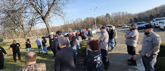 Workers rallying outside of a manufacturing plant