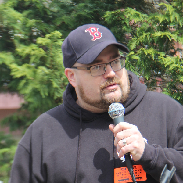 Man speaking into a microphone