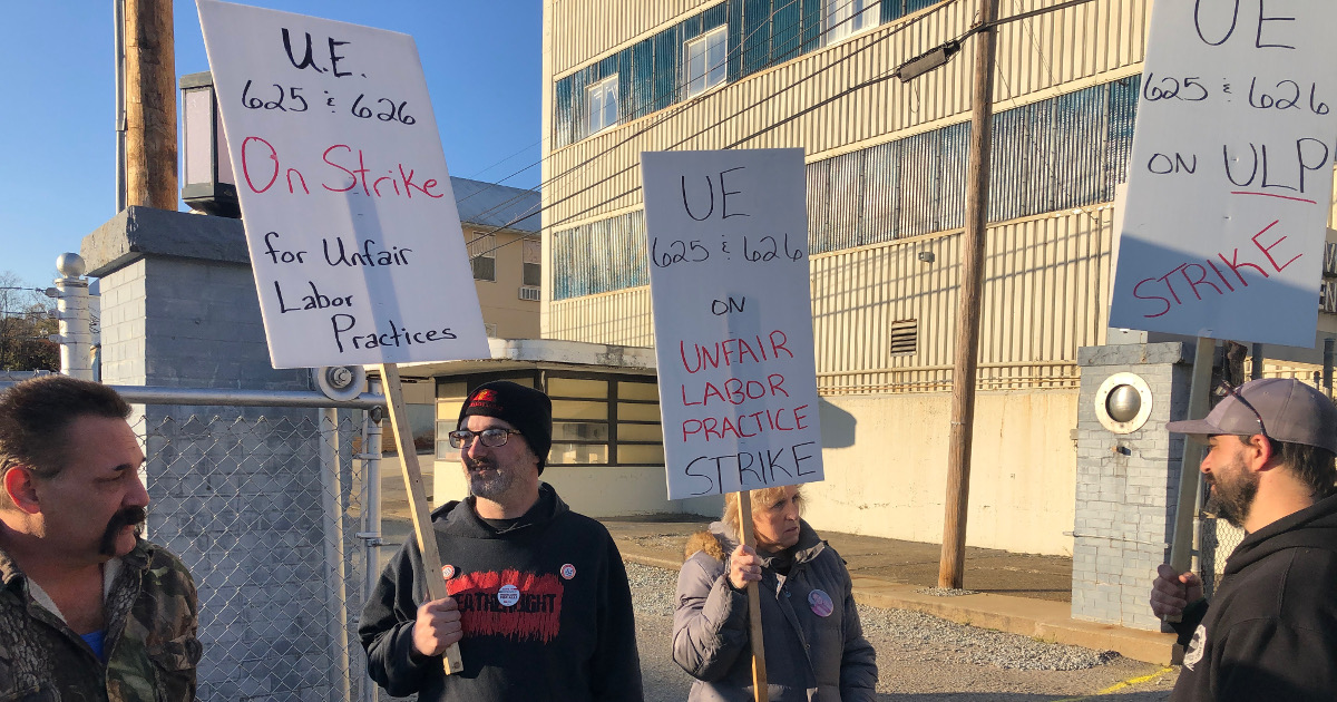 UE members with picket signs reading "UE 625 & 626 on Unfair Labor Practice Strike"