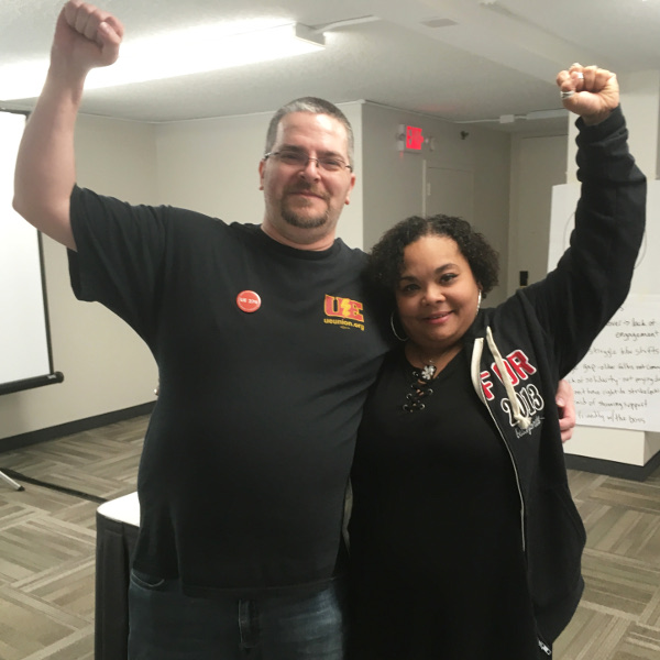 Bill Ladd  and Autumn Martinez embracing each other, with fists raised