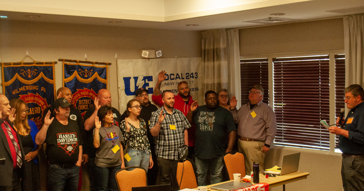 UE Director of Organization Mark Meinster swearing in newly-elected Eastern Region officers, executive board members and trustees