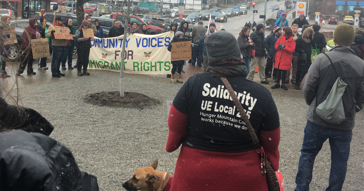 Antiwar rally in Burlington, VT, with a woman wearing a UE Local 255 "Solidarity" t-shirt