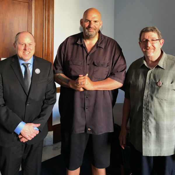 UE General President Carl Rosen (left) and retired UE Political Action Director Chris Townsend (right) with Senator John Fetterman (D-PA)