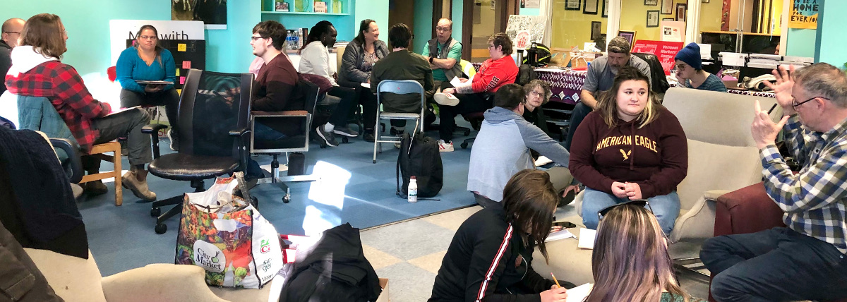 Stewards and officers from Vermont locals in small group discussions during a steward training