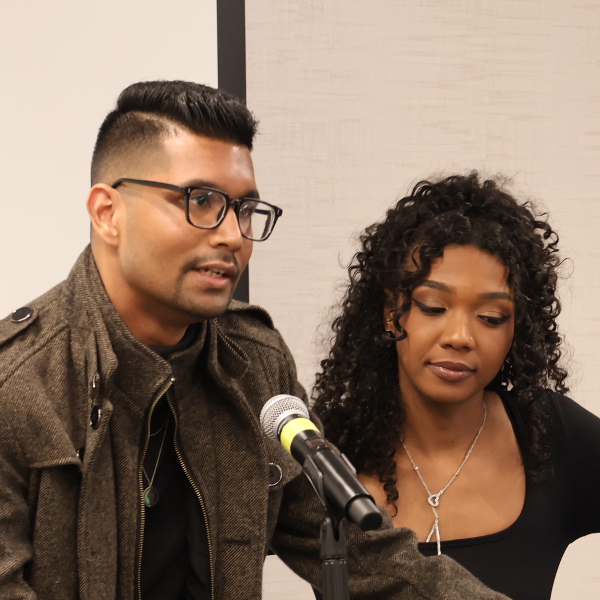 A man and a woman at a podium